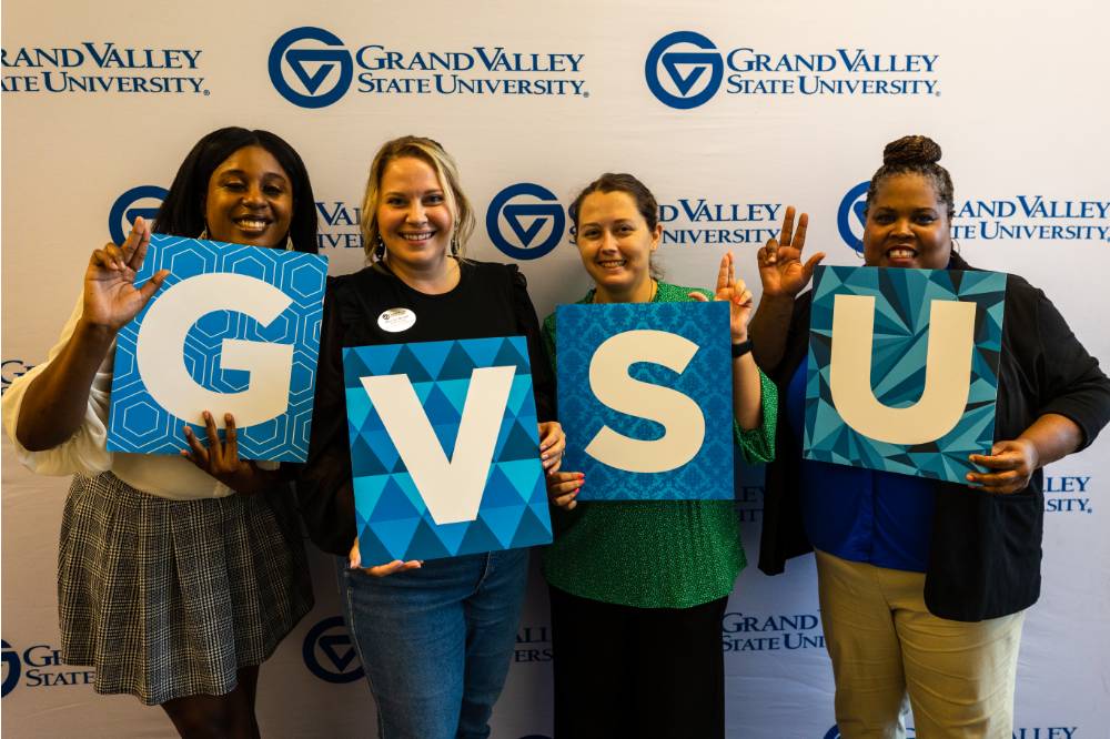 Group photo with each person holding the letters G V S U, while holding their Anchors Up
